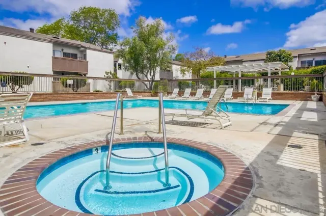 a view of a swimming pool with a patio