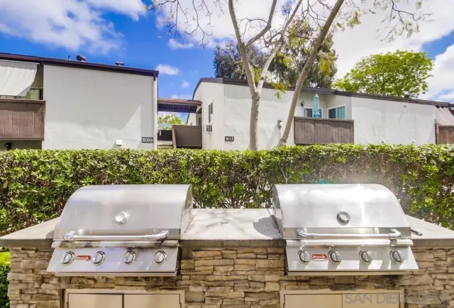 front view of house with a sink and a yard