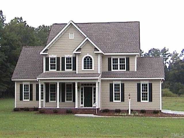 1741 Pearces Road Zebulon, NC 27597 - Photo 1 of 1 a front view of a house with a yard