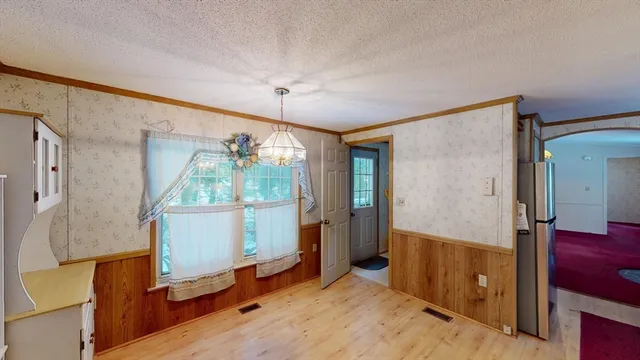 a kitchen with a white stove top oven and sink