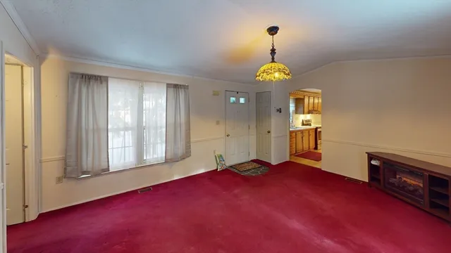 a kitchen with stainless steel appliances granite countertop a stove refrigerator and cabinets