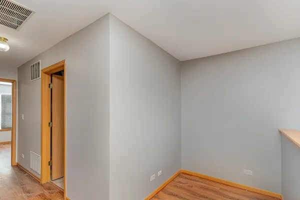 a view of small space with wooden floor