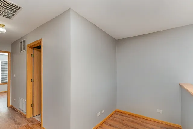 a view of small space with wooden floor