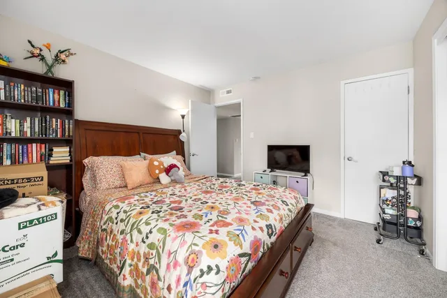 a bedroom with a bed and gym equipment