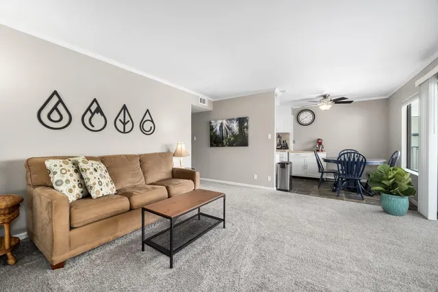 a living room with furniture and white walls