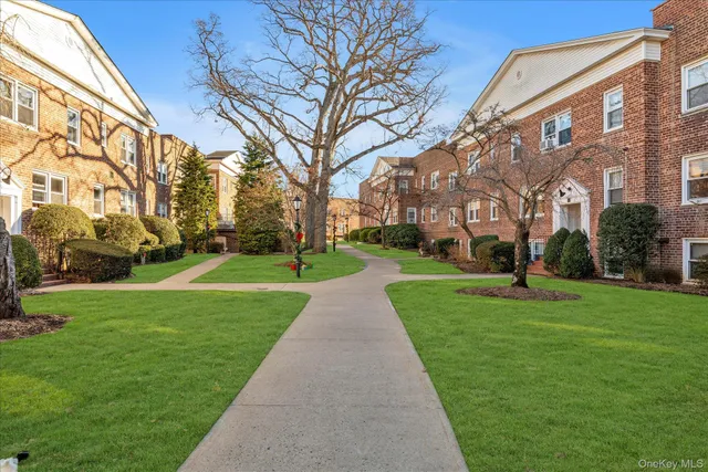 a sign board with a house and garden