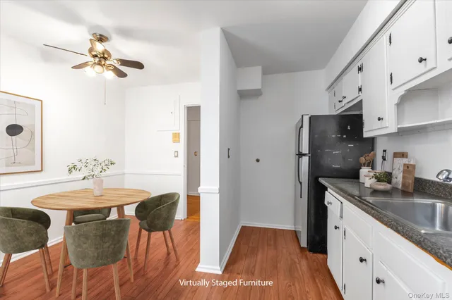 a kitchen with stainless steel appliances granite countertop a sink refrigerator and cabinets