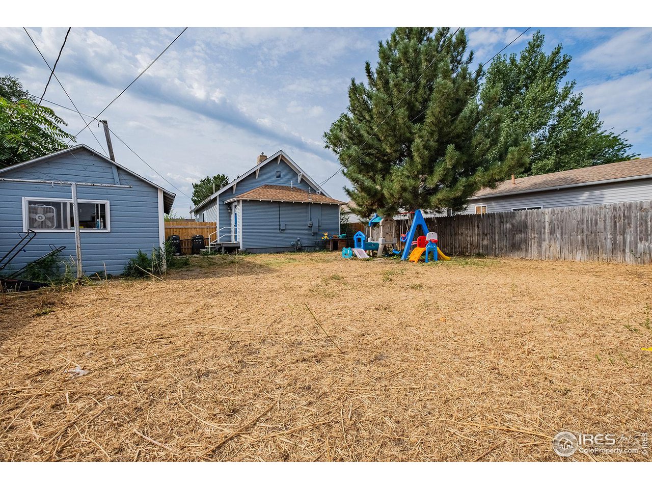 428 Douglas Street Sterling, CO 80751 - Photo 14 of 14 a view of a house with large outdoor space