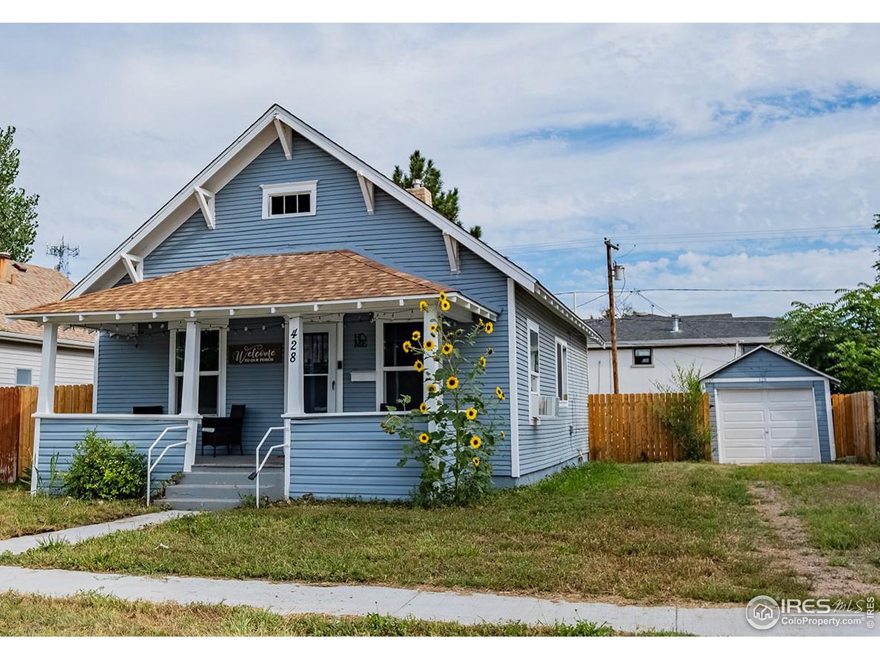 428 Douglas Street Sterling, CO 80751 - Photo 2 of 14 a view of a house with a yard