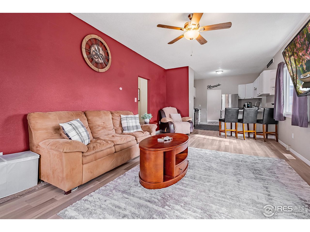 428 Douglas Street Sterling, CO 80751 - Photo 4 of 14 a living room with furniture and a table