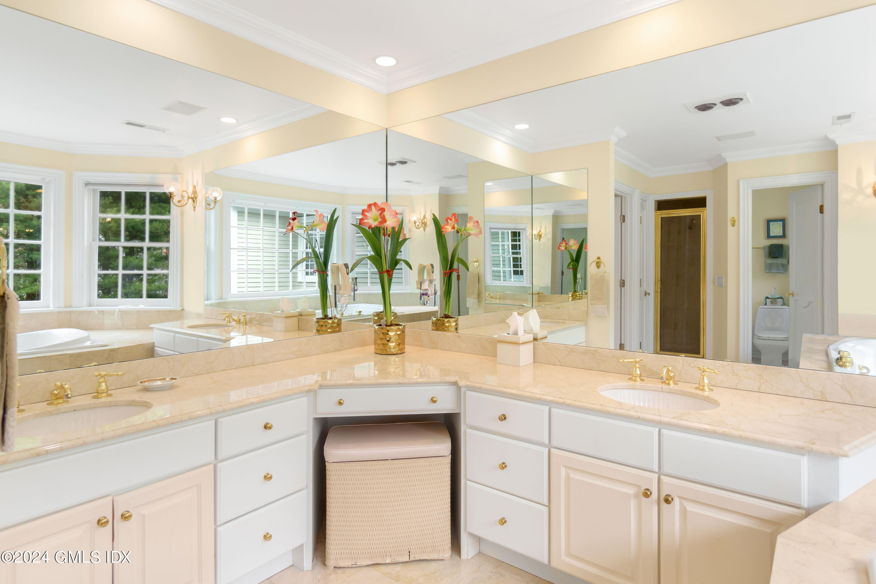 719 Ponus Ridge Road New Canaan, CT 06840 - Photo 15 of 38 a bathroom with a sink vanity and mirror