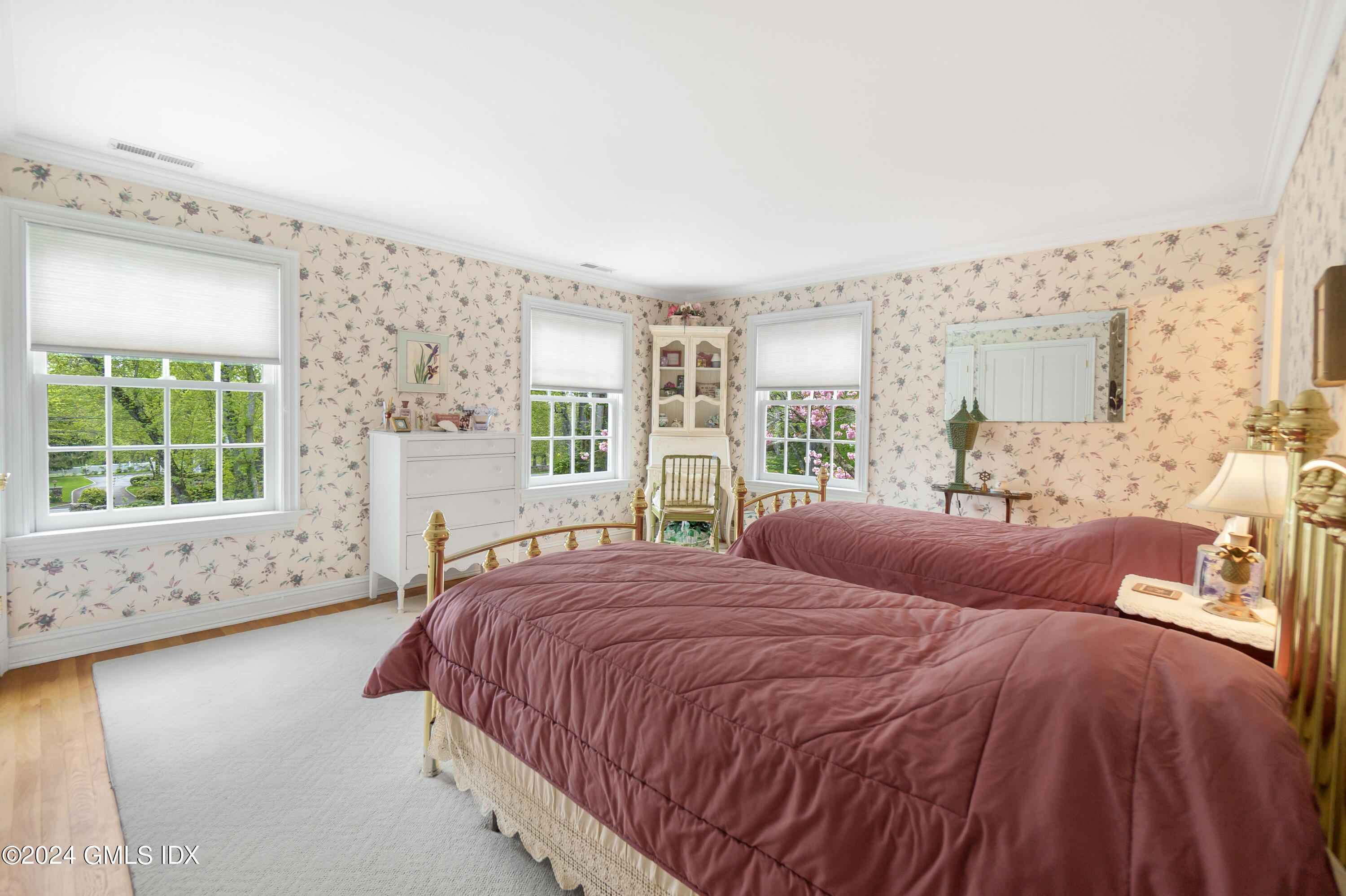 719 Ponus Ridge Road New Canaan, CT 06840 - Photo 16 of 38 a bedroom with a large bed and a window