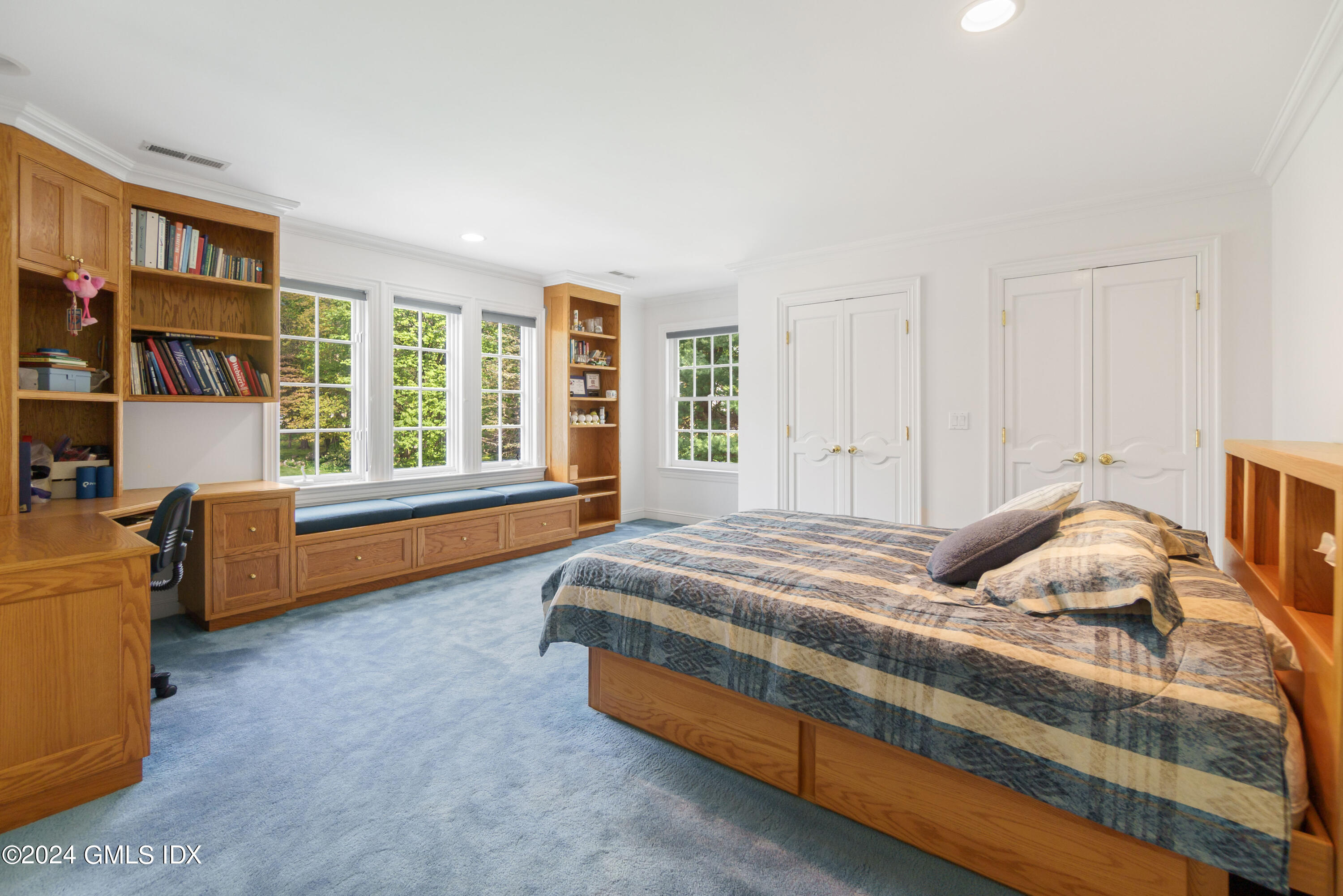 719 Ponus Ridge Road New Canaan, CT 06840 - Photo 20 of 38 a bedroom with bed and wooden floor