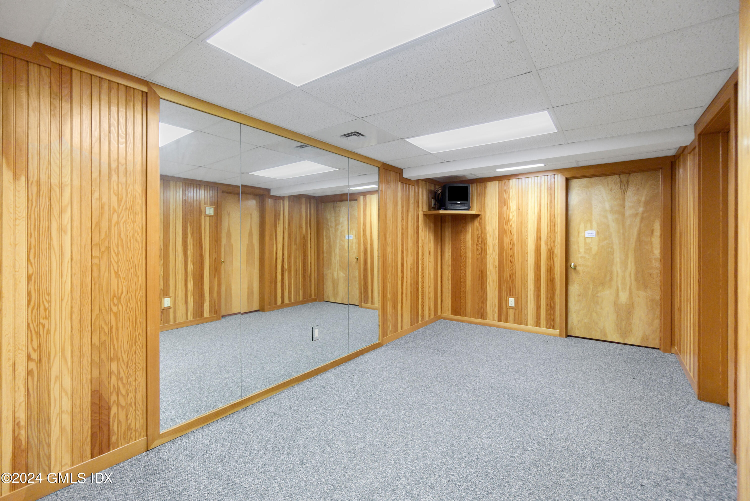 719 Ponus Ridge Road New Canaan, CT 06840 - Photo 26 of 38 a view of an empty room with a window