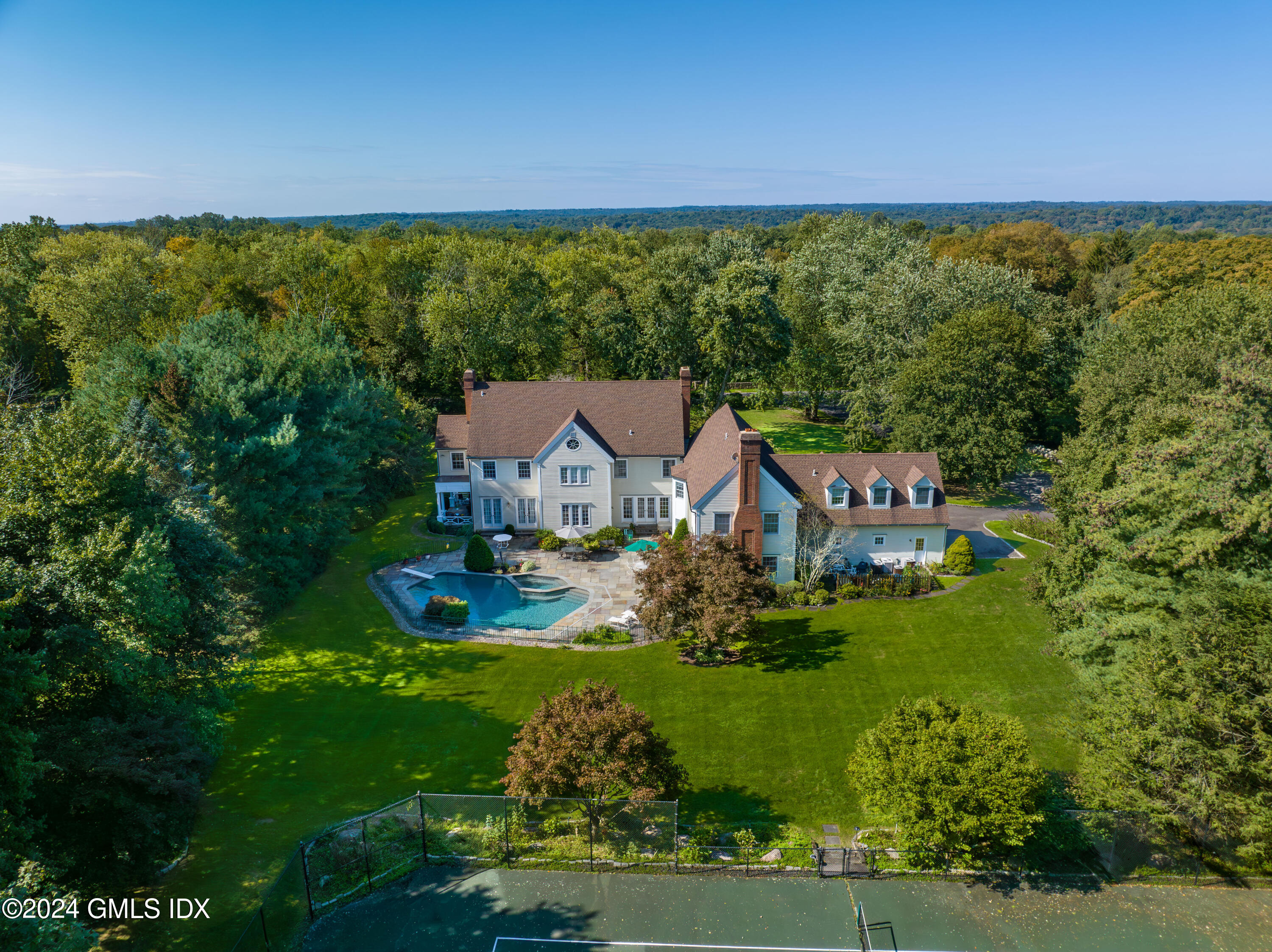 719 Ponus Ridge Road New Canaan, CT 06840 - Photo 31 of 38 an aerial view of a house with yard swimming pool and outdoor seating