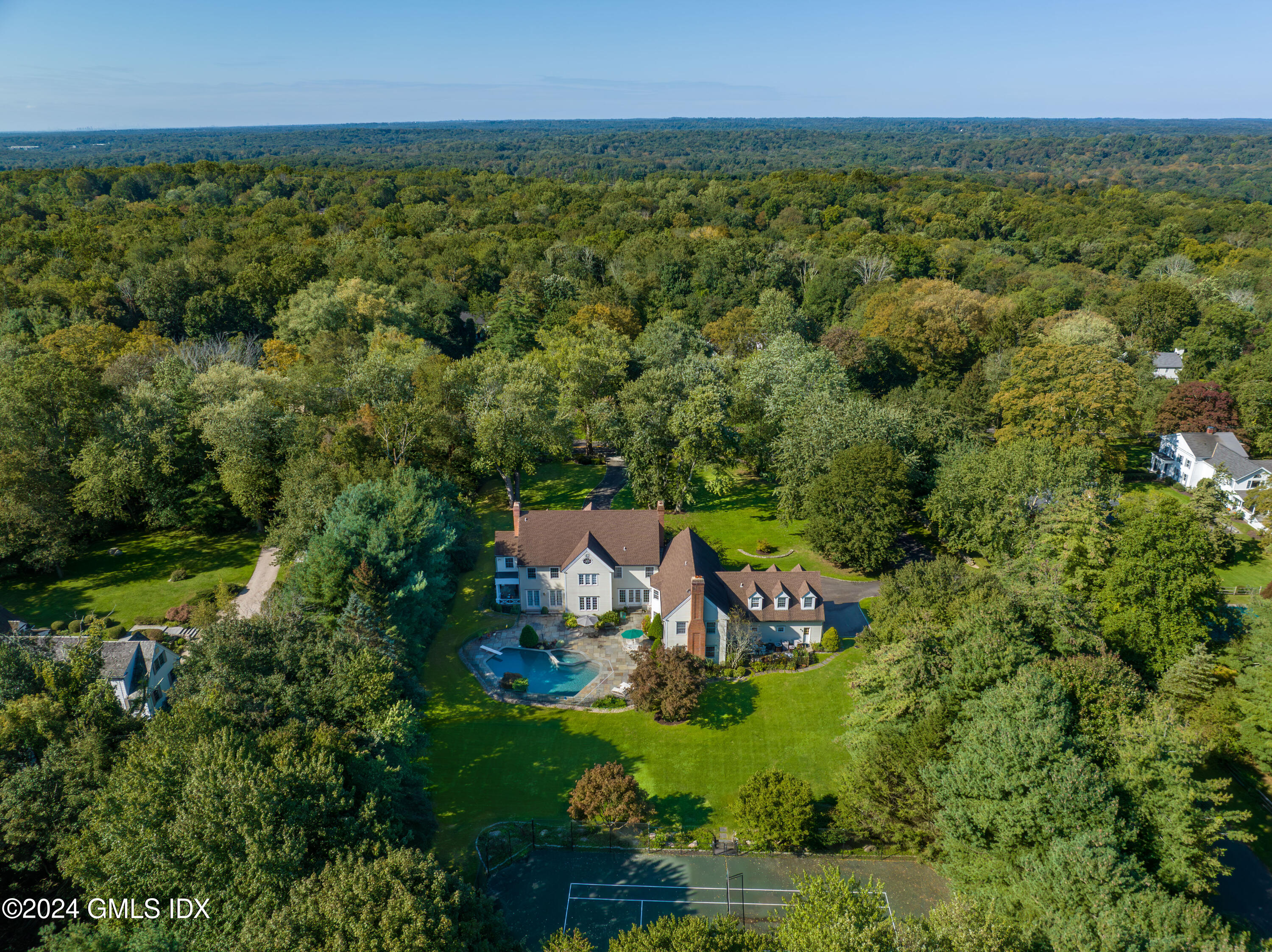719 Ponus Ridge Road New Canaan, CT 06840 - Photo 34 of 38 an aerial view of a house with a yard