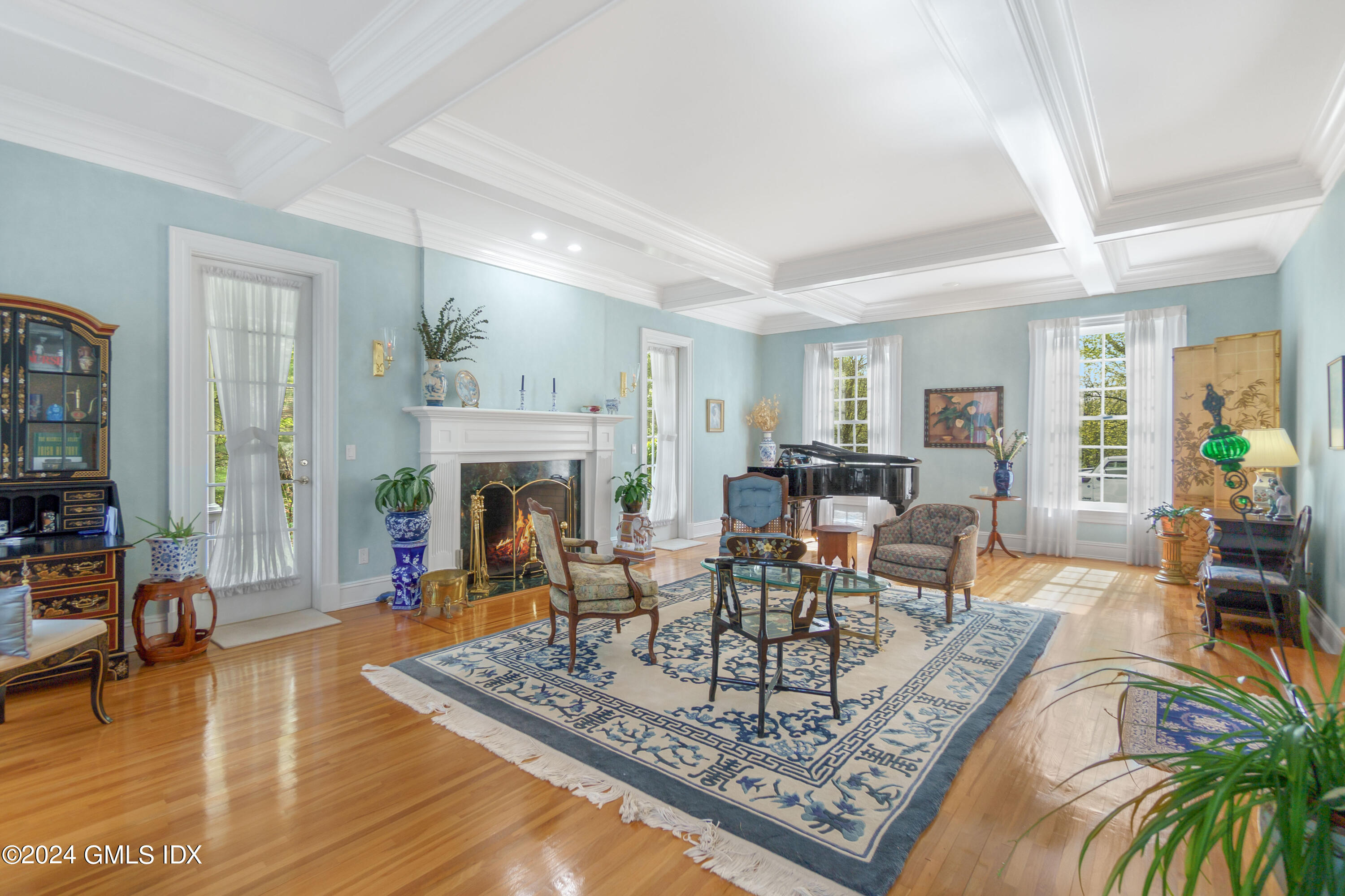 719 Ponus Ridge Road New Canaan, CT 06840 - Photo 4 of 38 a living room with furniture and a fireplace