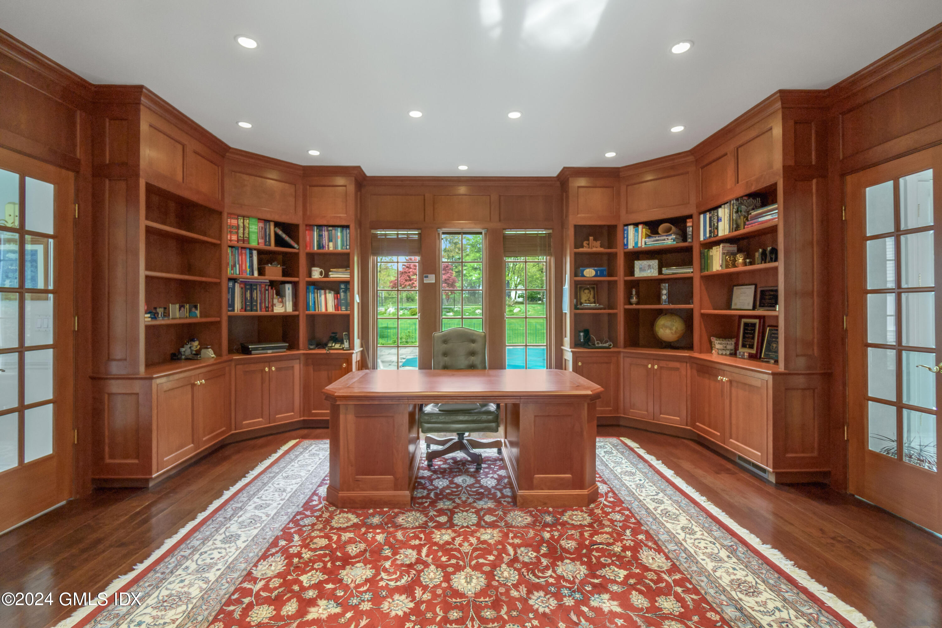 719 Ponus Ridge Road New Canaan, CT 06840 - Photo 9 of 38 a open kitchen with a large window and cabinets