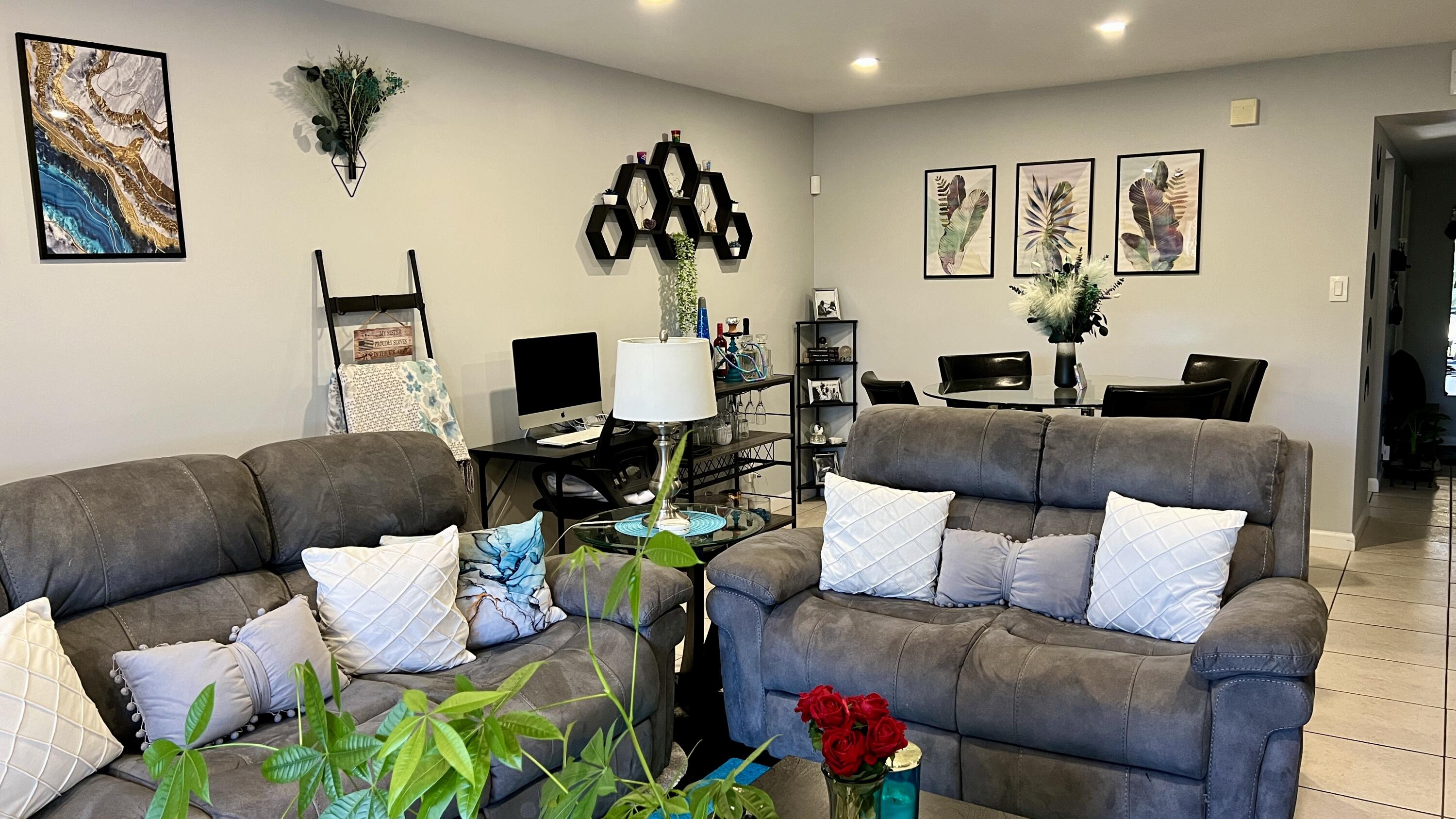 140 South Cypress Road, Unit 123 Pompano Beach, FL 33060 - Photo 14 of 23 a living room with furniture and a flat screen tv