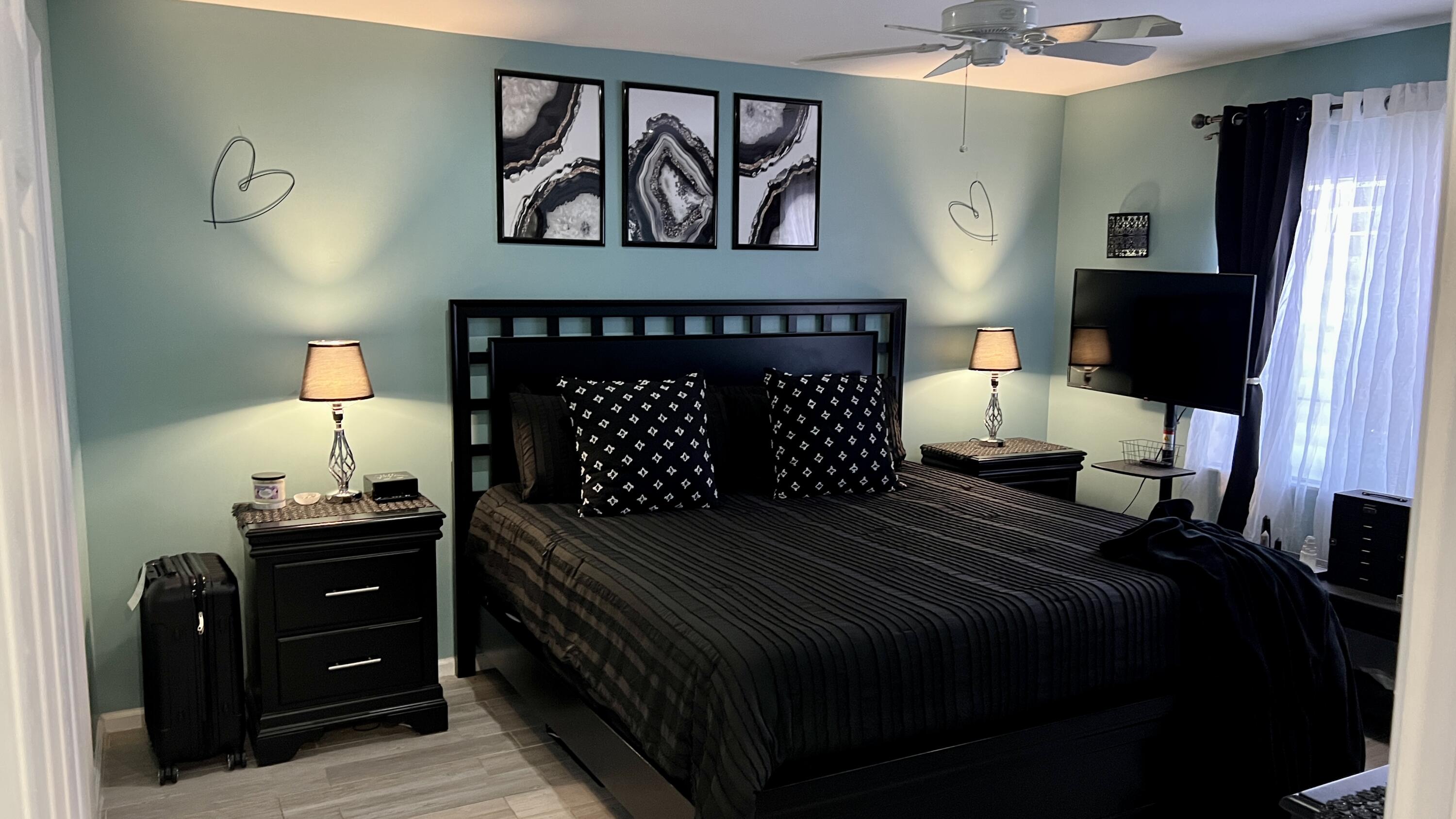 140 South Cypress Road, Unit 123 Pompano Beach, FL 33060 - Photo 15 of 23 a bedroom with a bed and a dresser