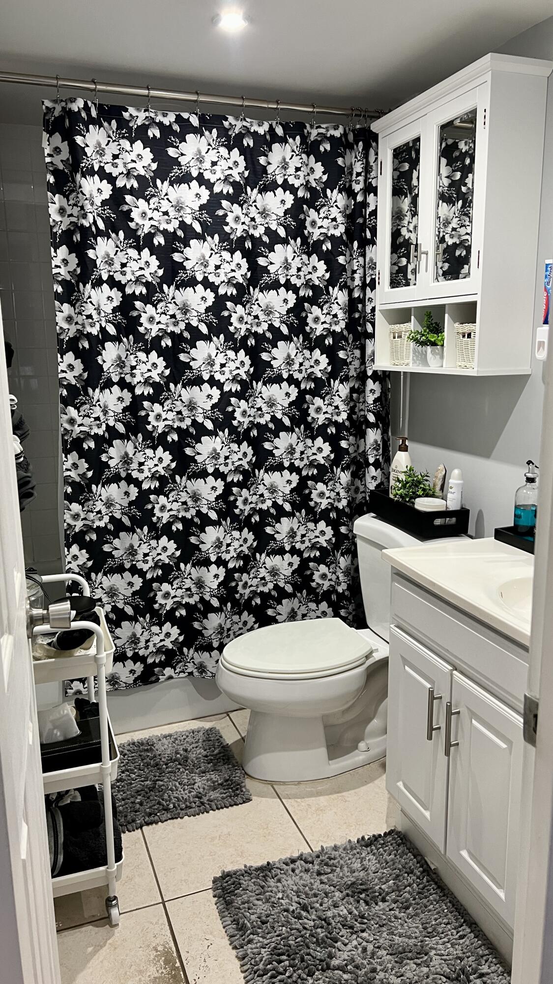 140 South Cypress Road, Unit 123 Pompano Beach, FL 33060 - Photo 19 of 23 a bathroom with a sink toilet and shower