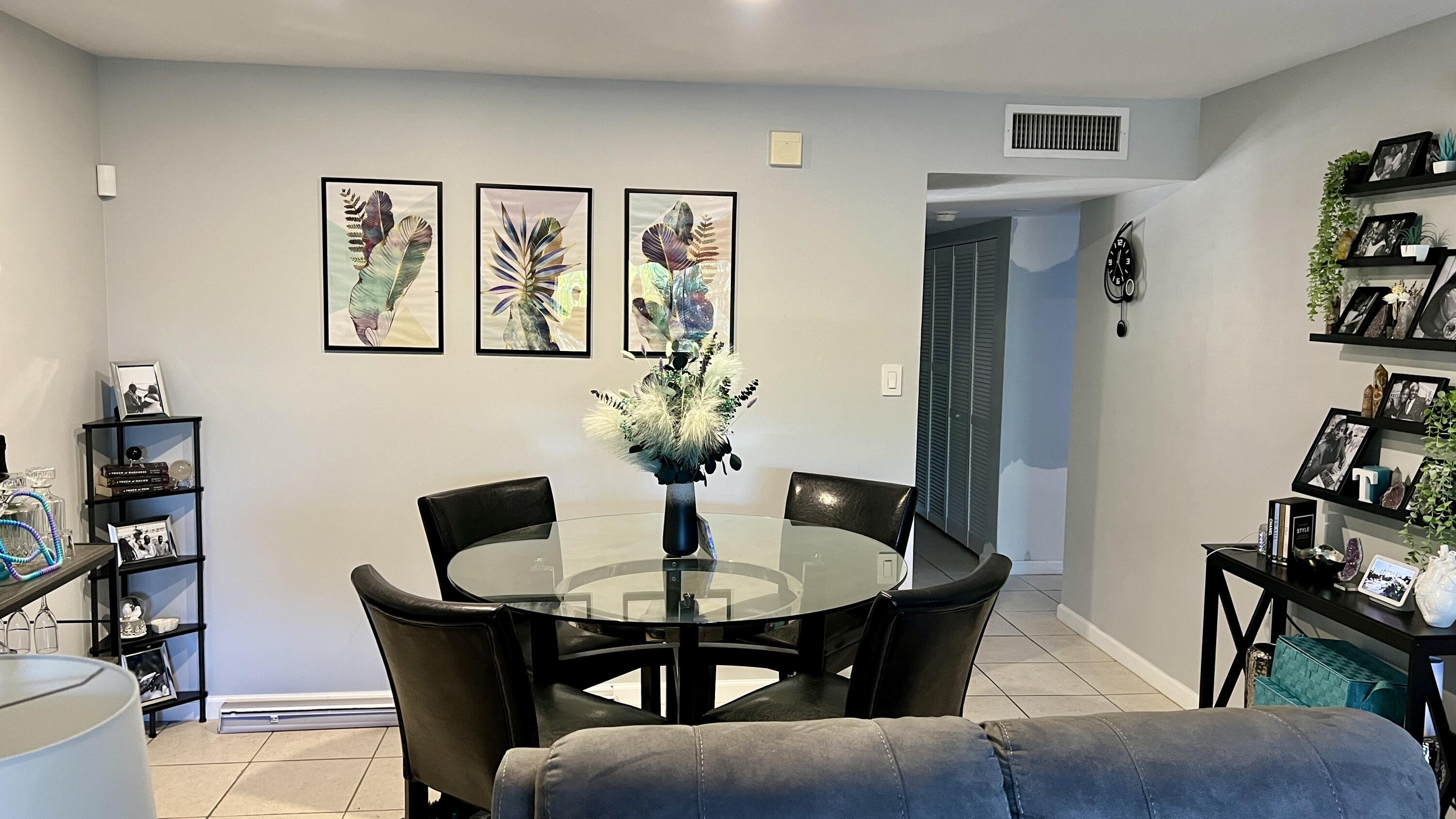 140 South Cypress Road, Unit 123 Pompano Beach, FL 33060 - Photo 23 of 23 a dining room with furniture and wooden floor
