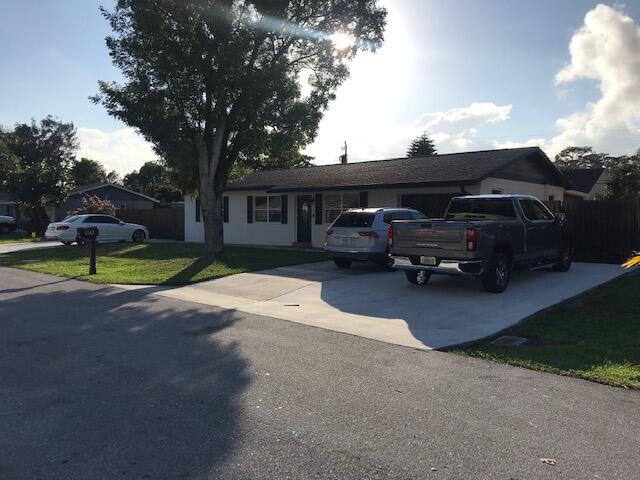 1141 Cheryl Road Haverhill, FL 33417 - Photo 2 of 20 front