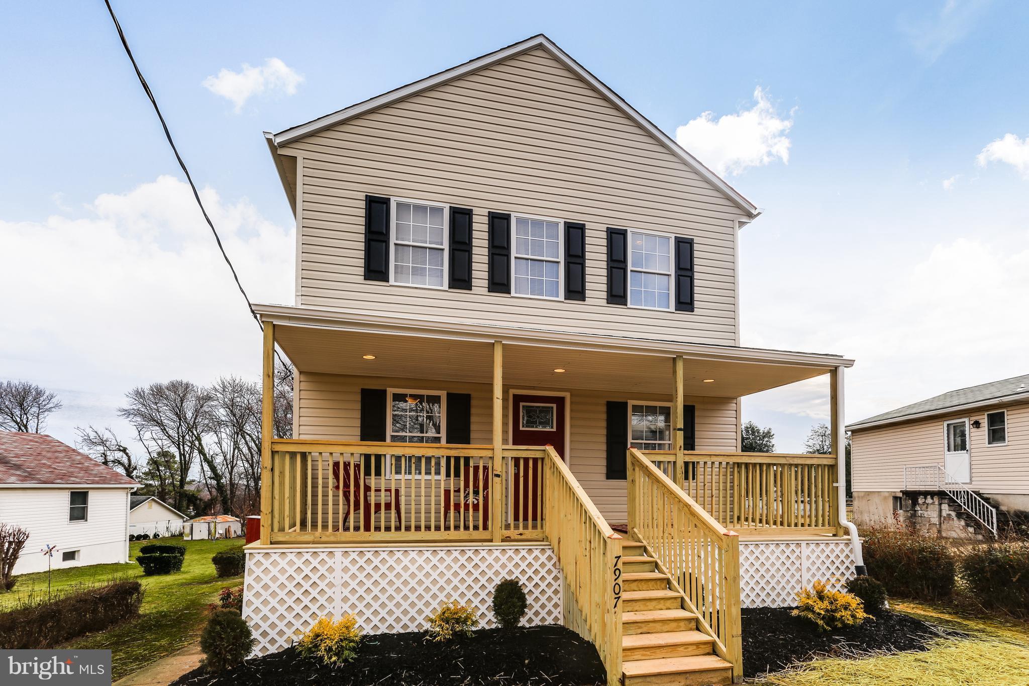 7907 Underhill Road Baltimore, MD 21237 - Photo 3 of 27 a view of a house with a wooden deck