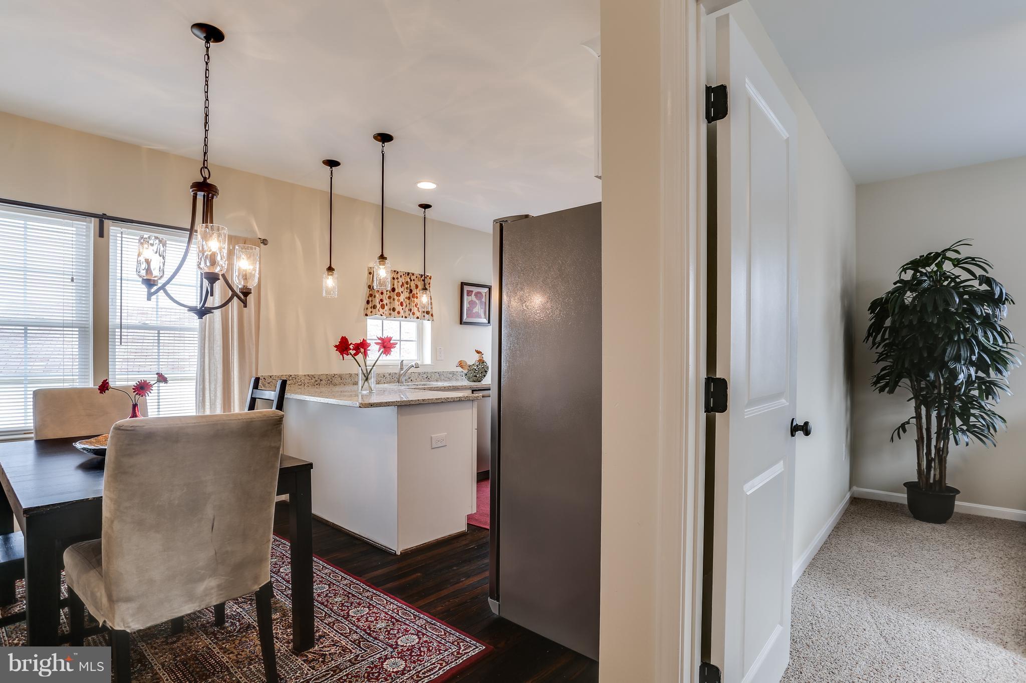 7907 Underhill Road Baltimore, MD 21237 - Photo 6 of 27 a kitchen with a table and chairs