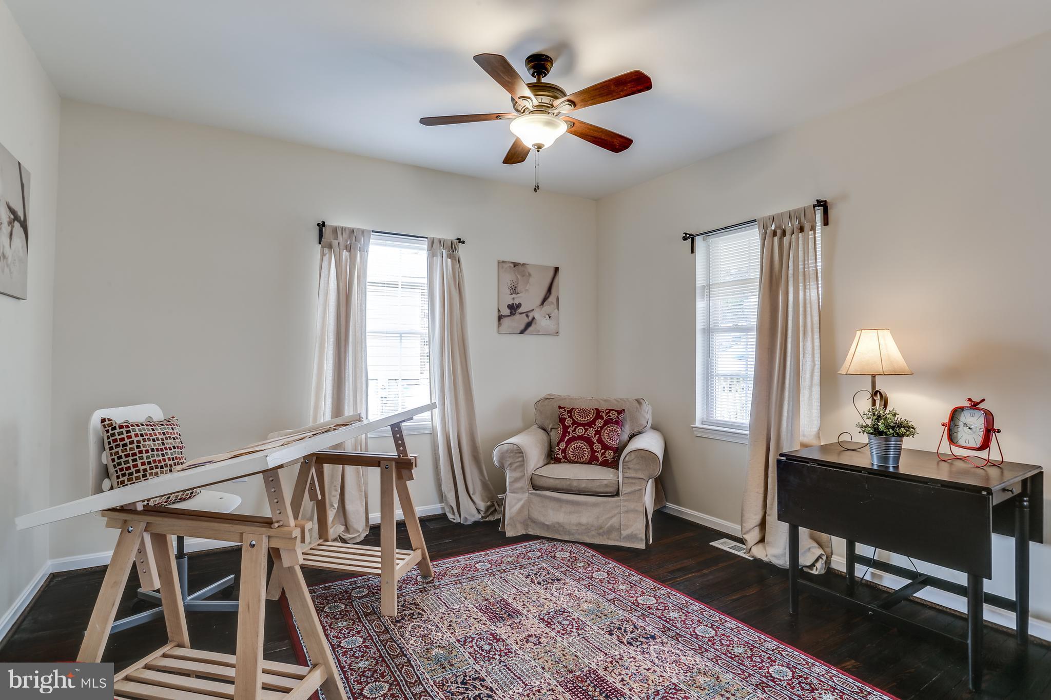 7907 Underhill Road Baltimore, MD 21237 - Photo 7 of 27 a living room with furniture and wooden floor