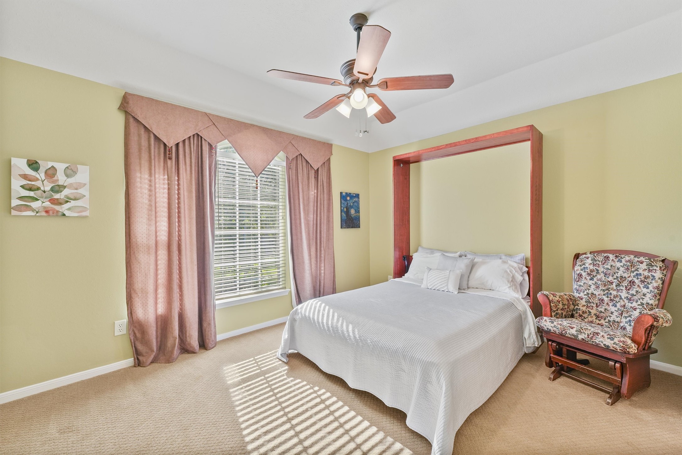 3006 Rothbury Drive Pearland, TX 77584 - Photo 16 of 28 a bedroom with a bed and a chandelier