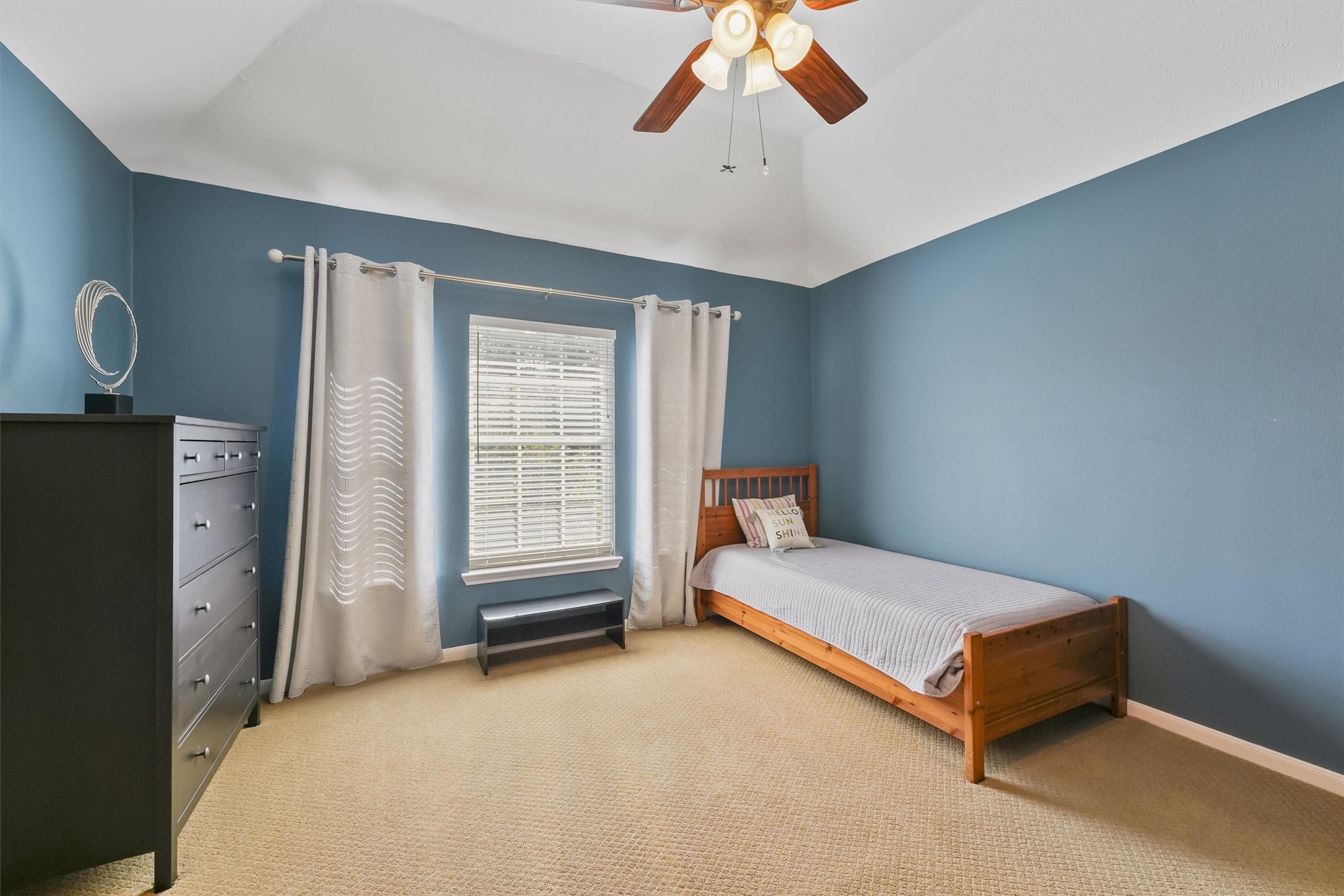 3006 Rothbury Drive Pearland, TX 77584 - Photo 20 of 28 a room with a bed and a chandelier
