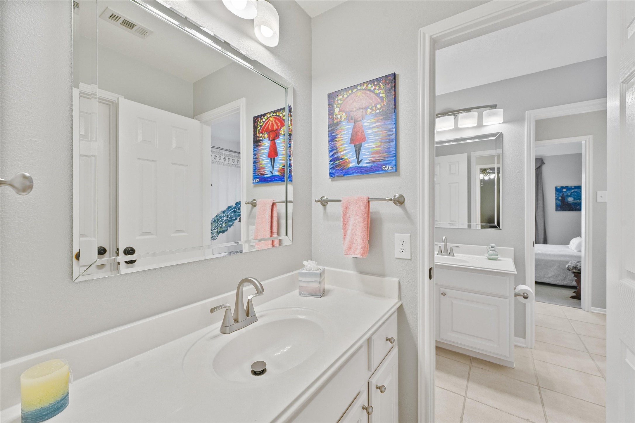 3006 Rothbury Drive Pearland, TX 77584 - Photo 21 of 28 a bathroom with a sink vanity and mirror