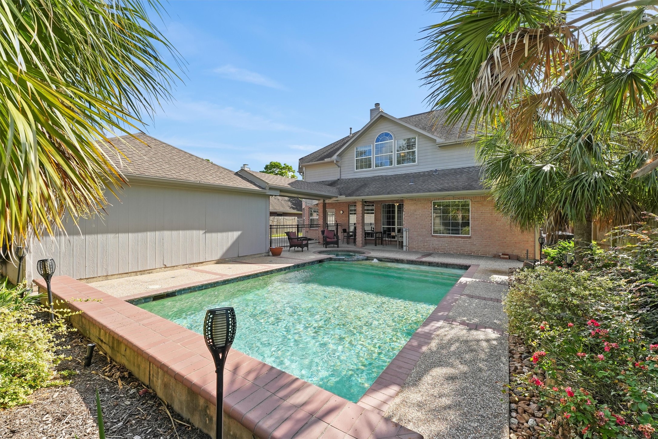 3006 Rothbury Drive Pearland, TX 77584 - Photo 24 of 28 a front view of a house with garden