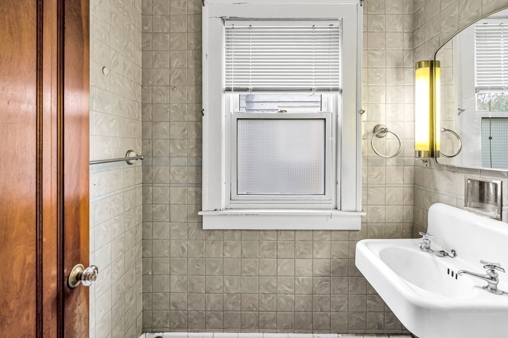104 Eleanor Road Springfield, MA 01108 - Photo 16 of 33 a bathroom with a sink a toilet and shower