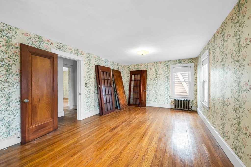 104 Eleanor Road Springfield, MA 01108 - Photo 20 of 33 a view of empty room with wooden floor and fan