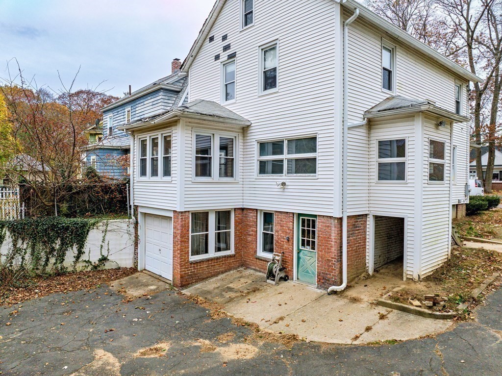 104 Eleanor Road Springfield, MA 01108 - Photo 26 of 33 a front view of a house with a yard