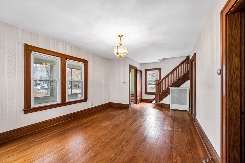 104 Eleanor Road Springfield, MA 01108 - Photo 7 of 33 a view of empty room with wooden floor and fan