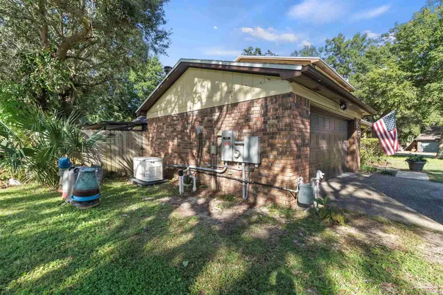 a view of a park with large trees