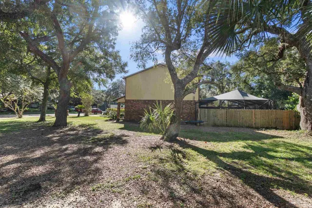 a wooden bench sitting in front of a building