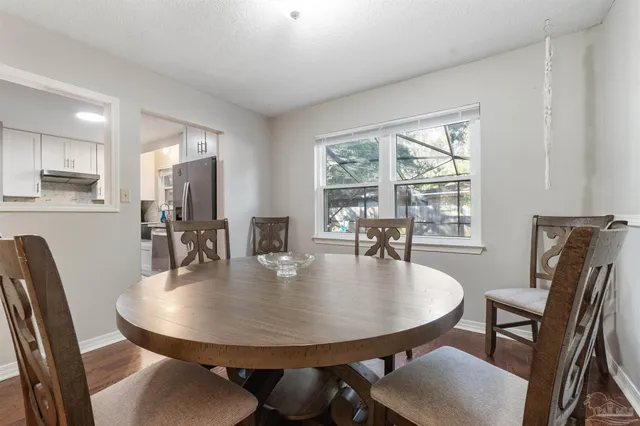 a kitchen with stainless steel appliances a stove and a refrigerator