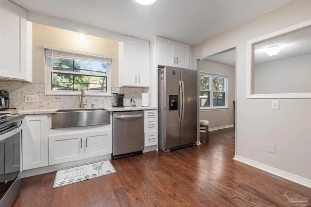 a white toilet sitting next to a shower curtain