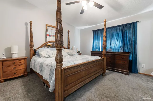 a white toilet sitting next to a bath tub