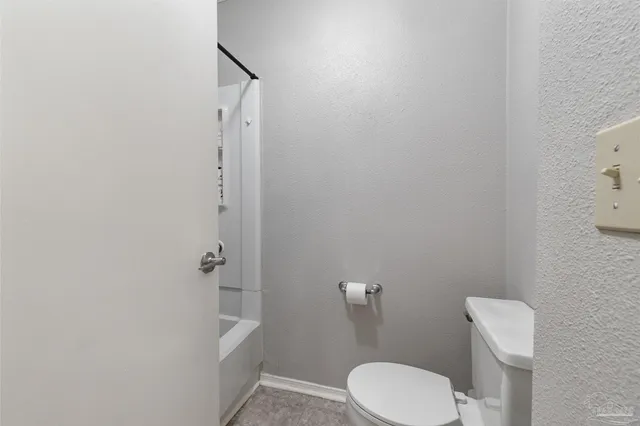 a bedroom with two beds and a chandelier