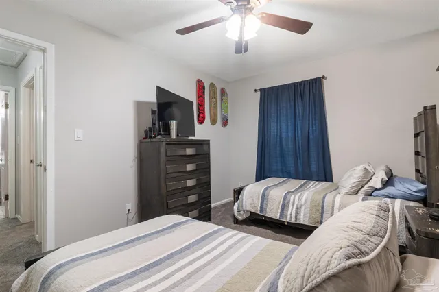 a bathroom with a toilet a sink and a mirror