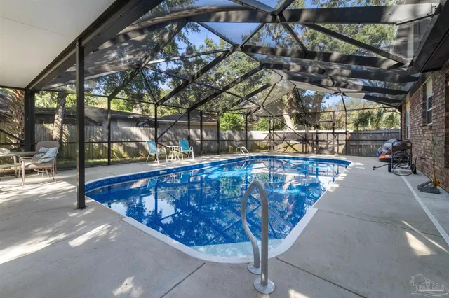 a view of a chairs and table in the patio