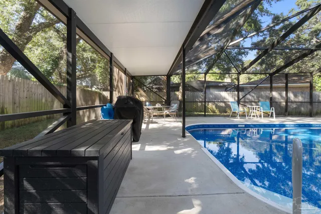 a view of a swimming pool with a patio