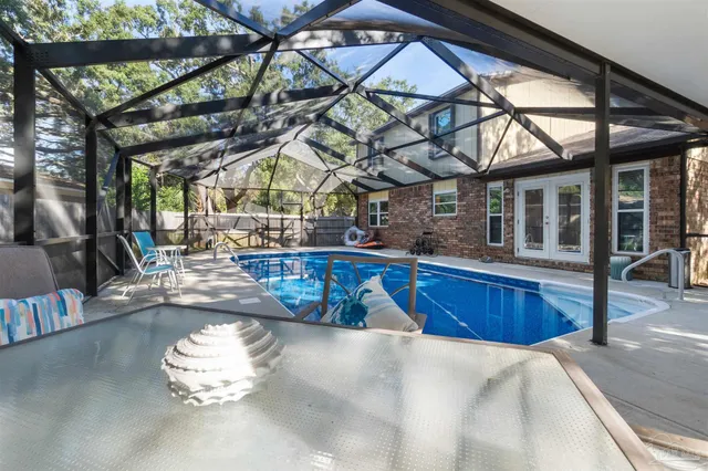 a view of a swimming pool with a patio