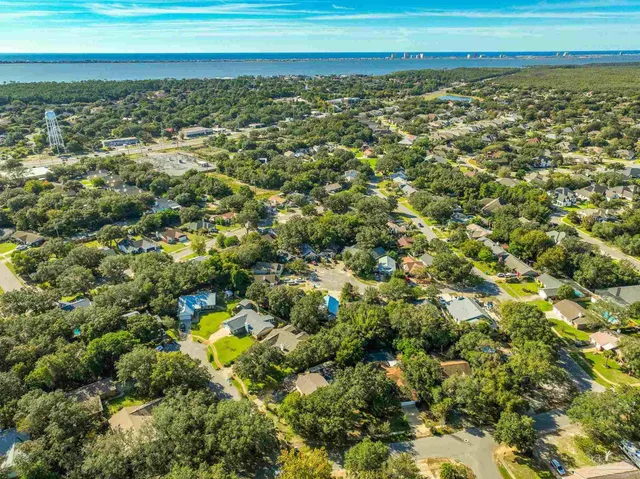 a view of a field with an ocean