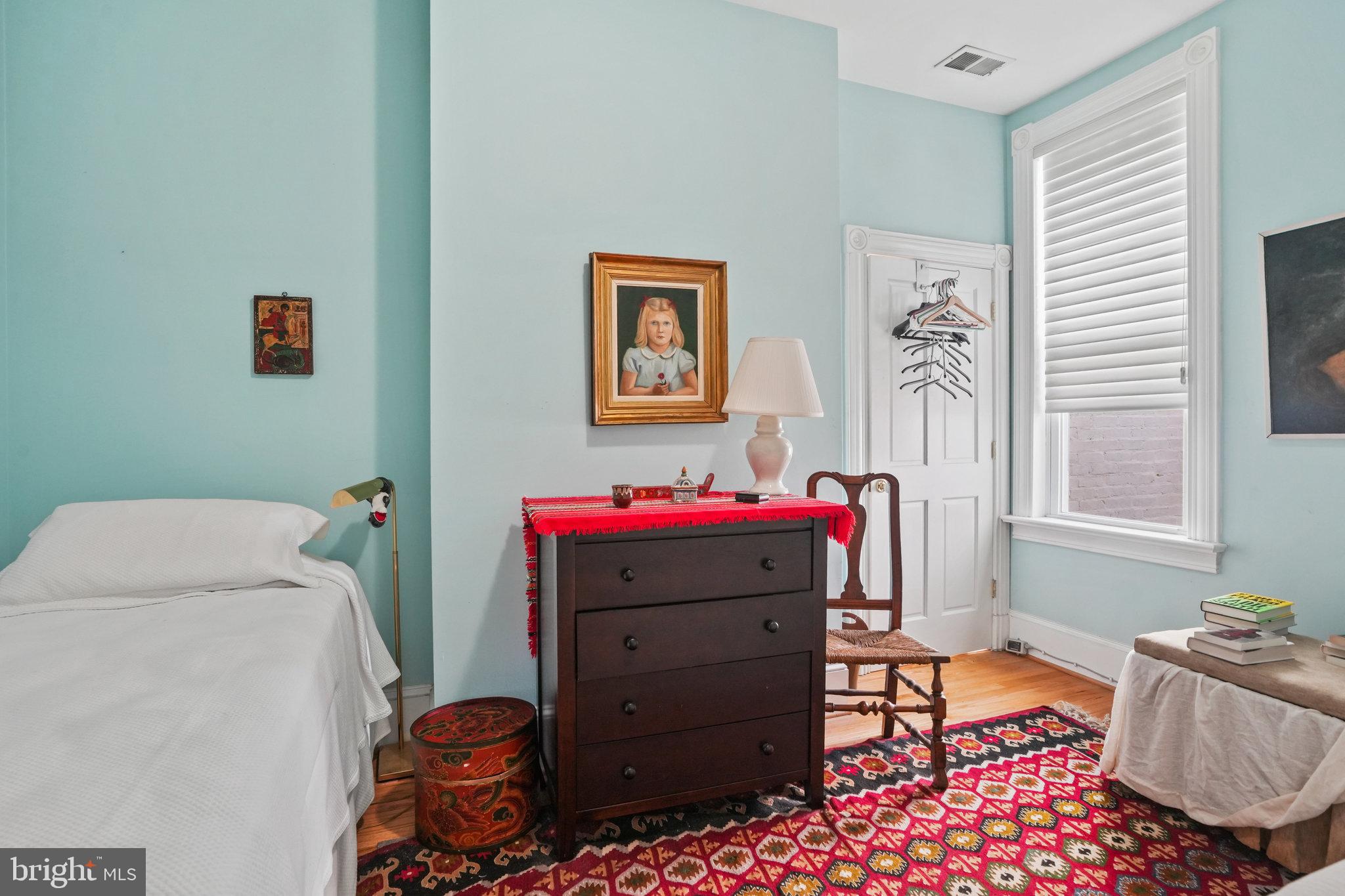 628 A Street Northeast Washington, DC 20002 - Photo 17 of 29 a bedroom with a bed and wooden floor